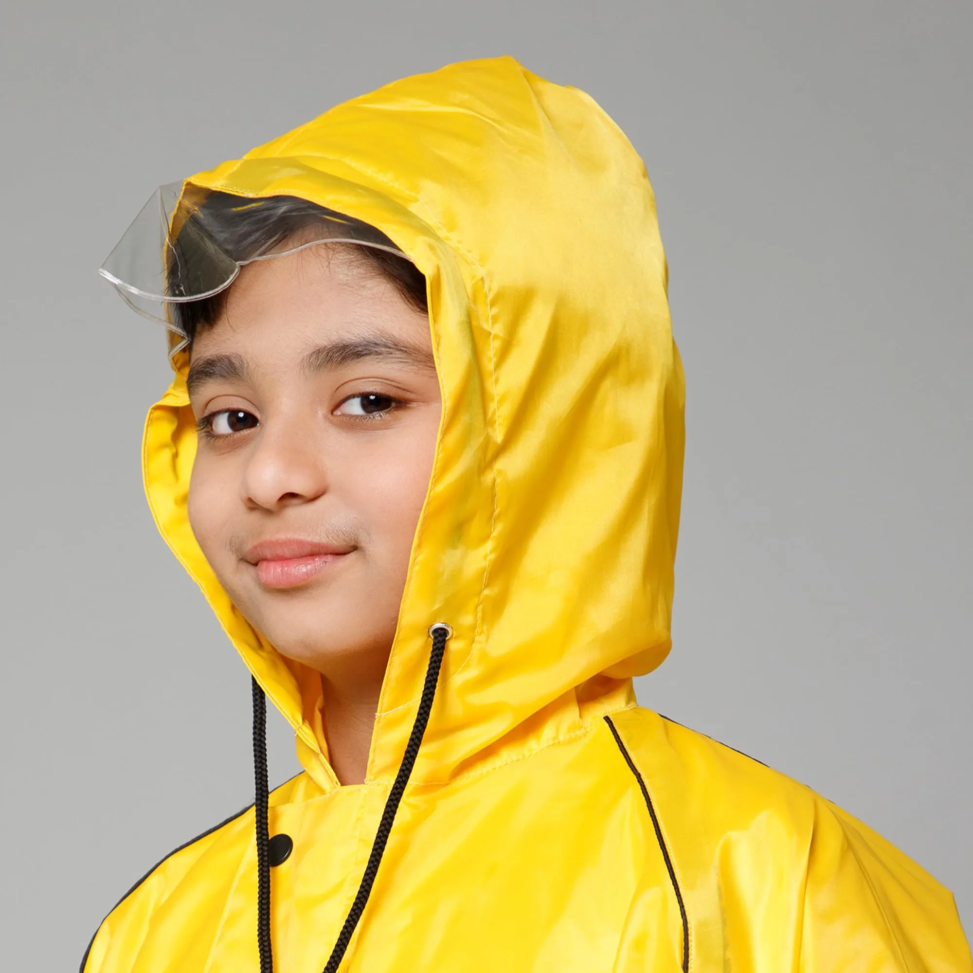 THE CLOWNFISH Duke Series Kids Waterproof Polyester Double Coating Reversible Raincoat with Hood and Reflector Logo at Back. Set of Top and Bottom. Printed Plastic Pouch. Kid Age-8-10 years (Yellow)