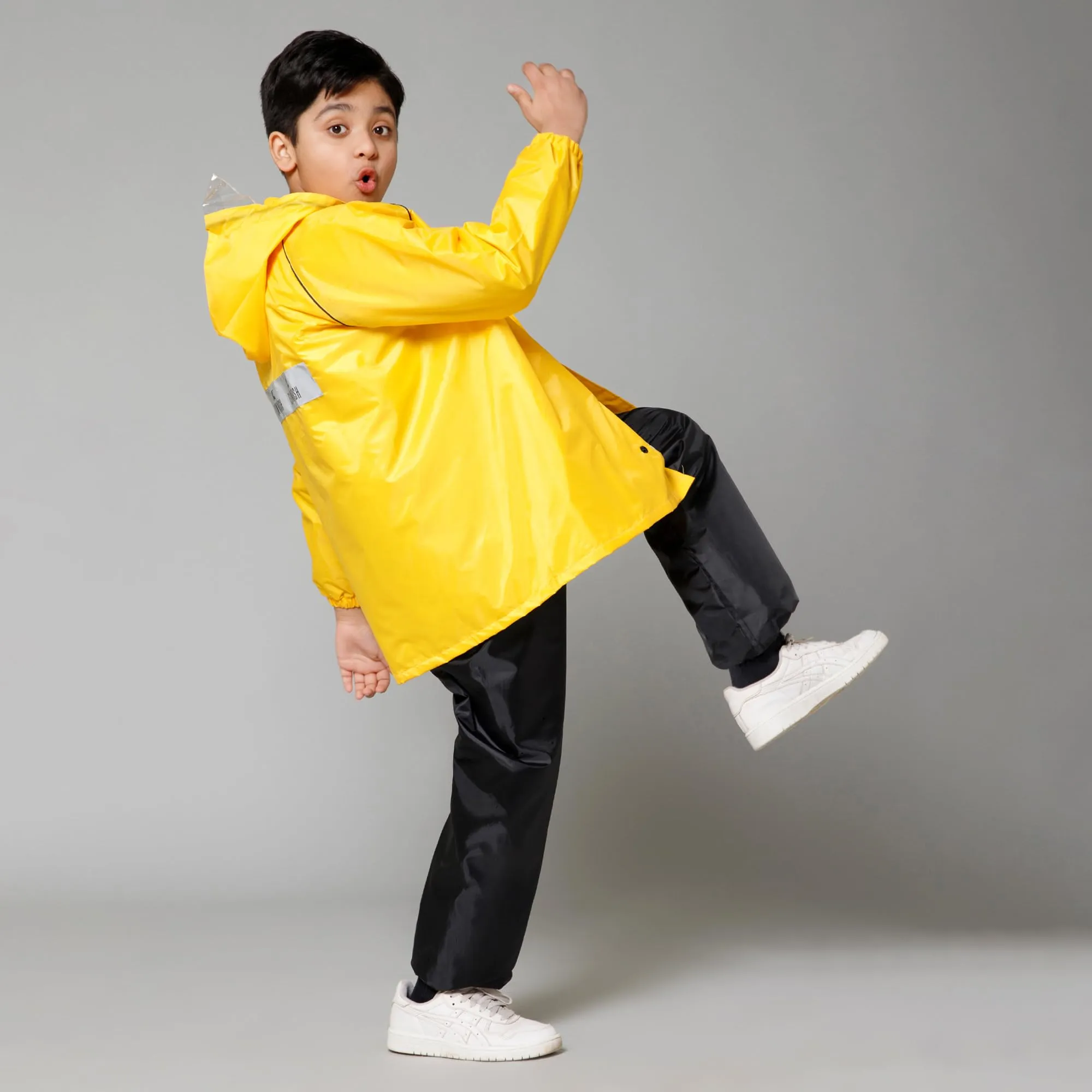 THE CLOWNFISH Duke Series Kids Waterproof Polyester Double Coating Reversible Raincoat with Hood and Reflector Logo at Back. Set of Top and Bottom. Printed Plastic Pouch. Kid Age-8-10 years (Yellow)